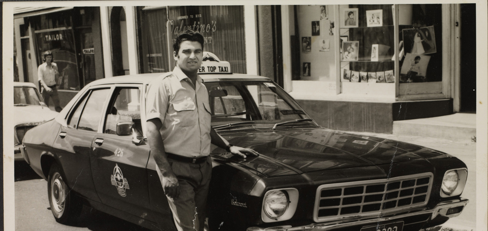 Portrait of taxi driver in front of the first taxi he drove, ca. 1972.