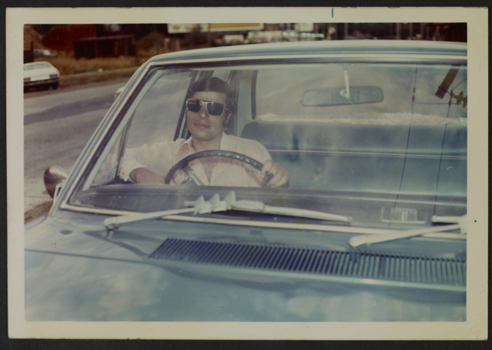 Portrait of a man at the wheel of a car, ca. 1972. 