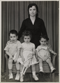 Portrait of a mother with her three children, ca. late 1960.