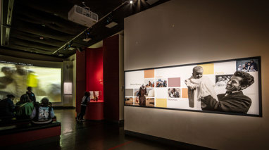 Displays telling stories of immigration in the Leaving Home exhibition at Immigration Museum.