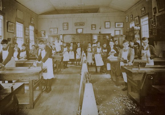 Old photograph of woodwork students in the classroom