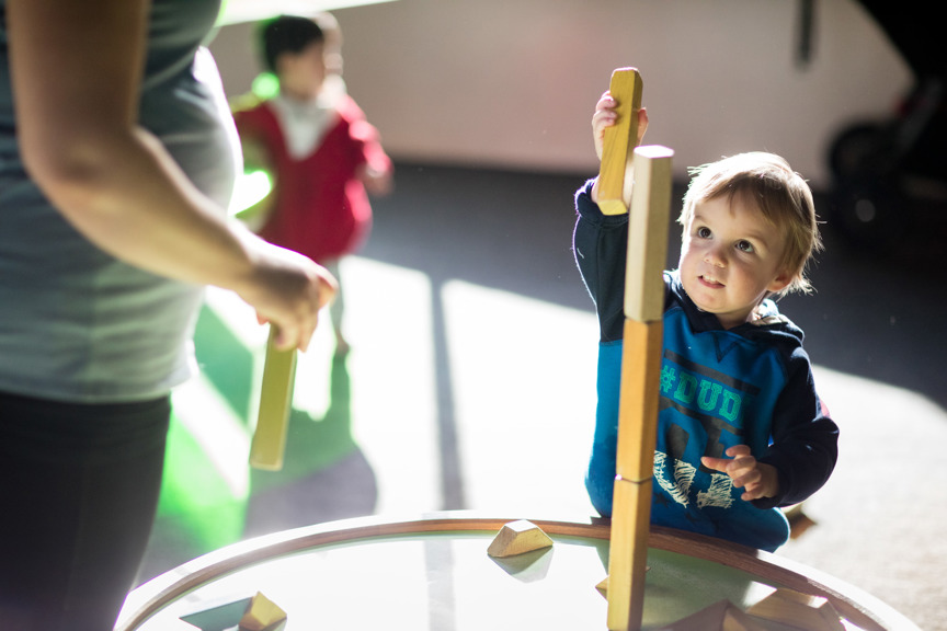 Toddler playing with building blocks