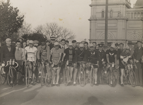 Group of Bicycle Riders with Exhibition Building in the background, Carlton, 1920s-1930s.