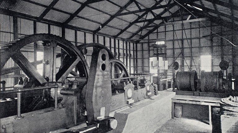 Interior view of engine house showing mining pumping equipment.