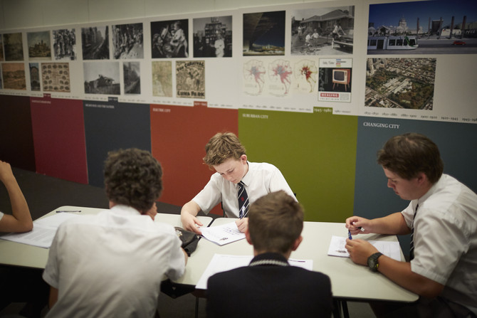 A groups of students working around a desk