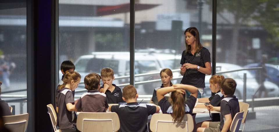 Teacher and students at a table