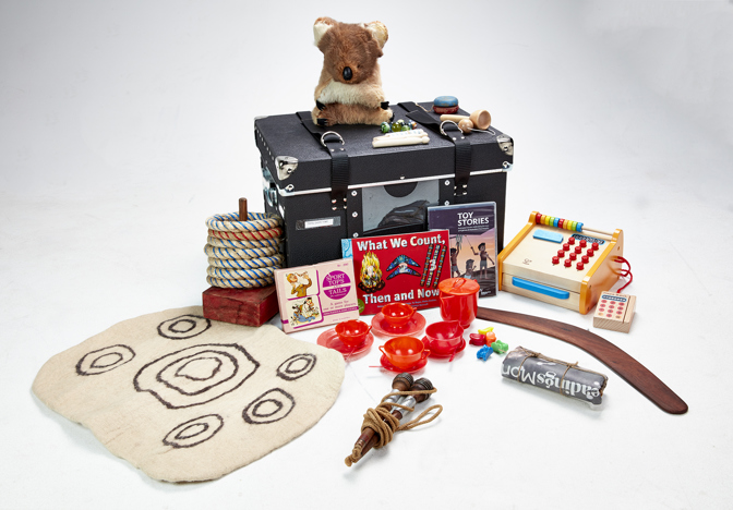 A black case with a variety of toys layout beside it