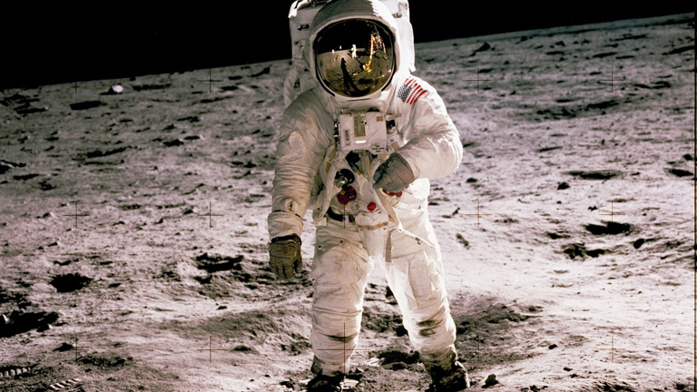 Buzz Aldrin standing in the Sea of Tranquility, on the lunar surface.