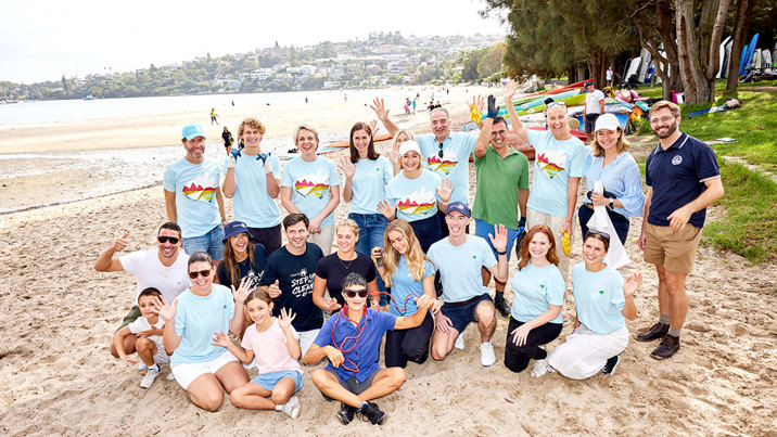 A group of people cleaning up the beach