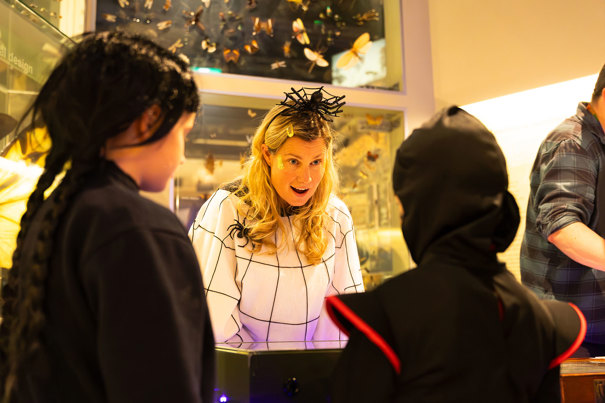Children being shown creepy crawly collections by Museums Victoria experts during Halloween at the Museum.
