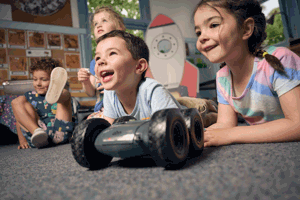 Kindergarten children explore and code rover robots on an imaginary mission to Mars, programming robots around obstacles as they discover how robots can be programmed during Museum Victoria's Rockets and Robots kindergarten incursion program.