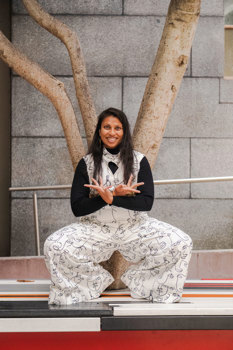 Arti Shah poses in front of a tree.
