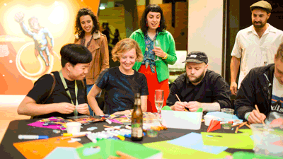 Adults crafting during Nocturnal, Melbourne Museum.
