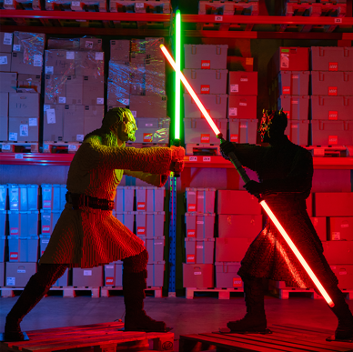 Qui-Gon Jinn the Jedi master and the Darth Maul the Sith Lord crossing lightsabers in a duel in LEGO® Star Wars: The Exhibition at Melbourne Museum.