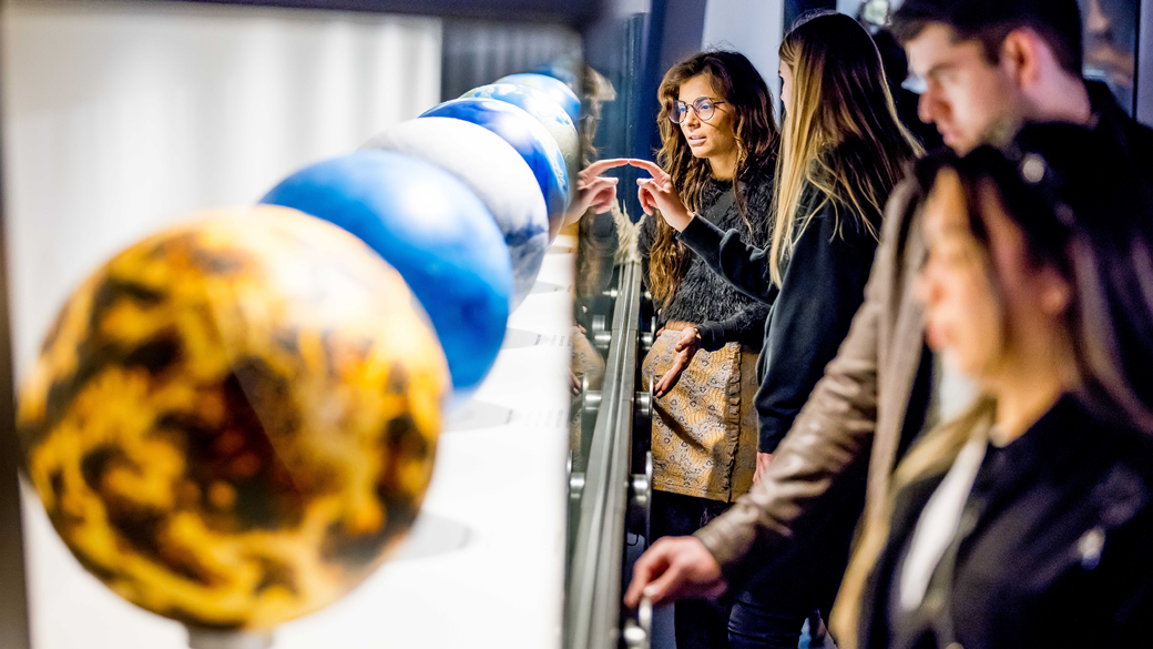 Adults visiting Dynamic Earth exhibition during child-free hours at Nocturnal, Melbourne Museum.