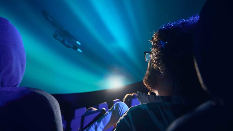 A man watches a film at the planetarium at Scienceworks.