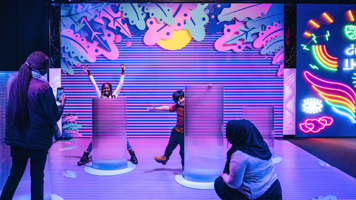 Two children playing in Illuminate How Science Comes To Light Echibition.