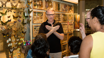 Selwyn Hoffmann presenting the Auslan tour to families in Bugs Alive exhibition at Melbourne Museum