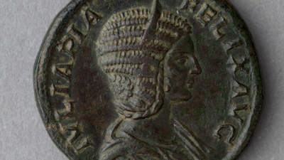 A large bronze Roman coin featuring Empress Sestertius