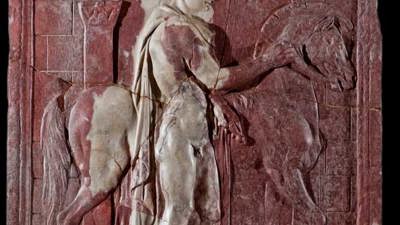 Relief featuring Dioscure beside a horse in front of a roman arch.
