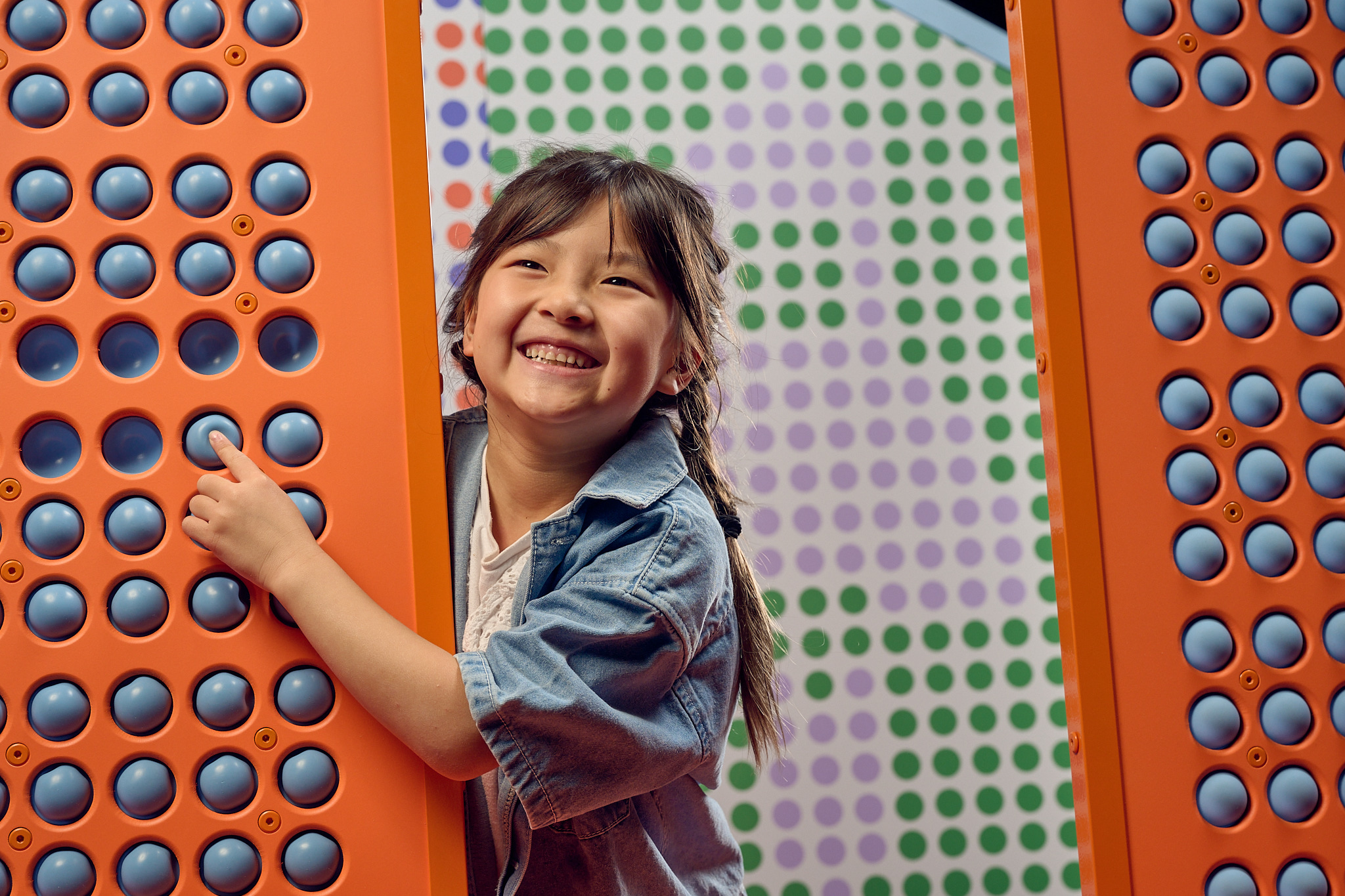 Smiling young child plays at Scienceworks