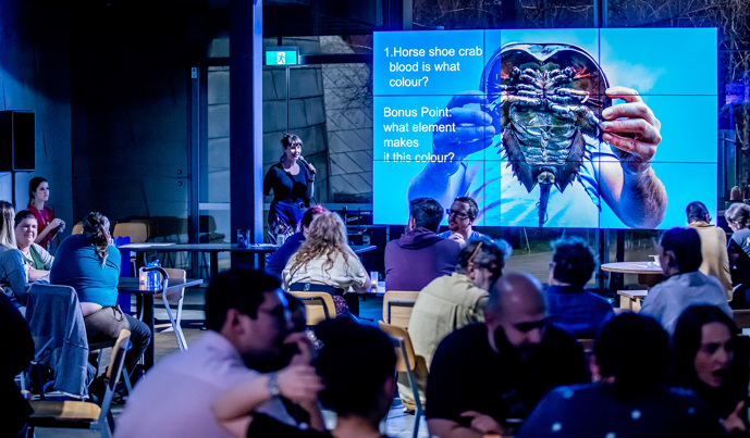 A crowd enjoy trivia at Nocturnal: Museum after Dark, Melbourne Museum.