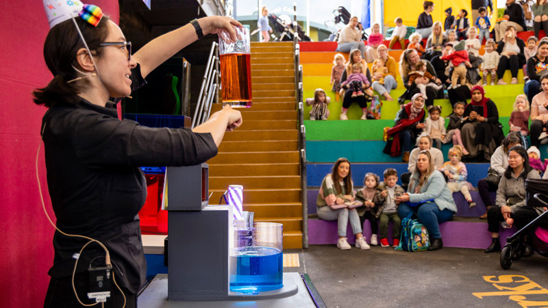  Families watching The Colour Combo Show in the Ampitheatre, during the 'Little Kids day In - Ready, Set, Glow' event at Scienceworks.
