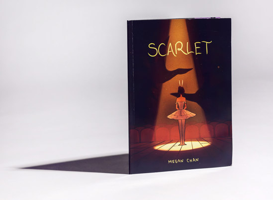 Book cover titled 'Scarlet' by Megan Chan, featuring a ballerina in a pink tutu, standing under a spotlight on a stage, facing rows of empty seats.