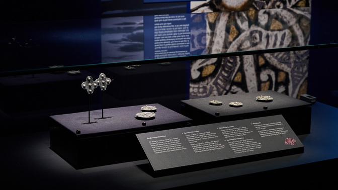 Galloway Hoard artefacts on display, showing metalwork pieces in display case against a dark background