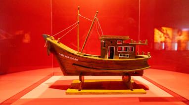  Model fishing boat on display in Leaving Home exhibition at the Immigration Museum