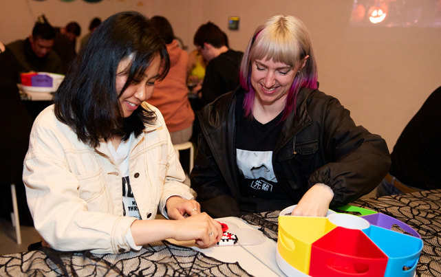 Visitors making Creepy Keyrings during Scienceworks After Dark 2025 event where adults step into the shadows during this spine-tingling after-hours event.