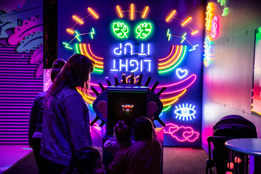 Children playing in Illuminate Exhibition.