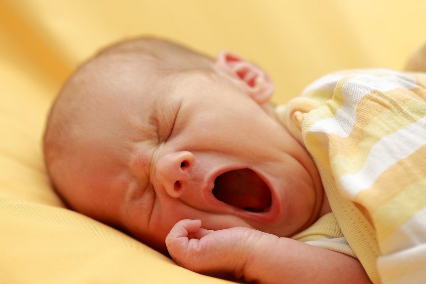 A baby yawning