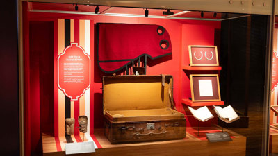 Displays showings Phar Lap artefacts including a suitcase, wrist guards, journals and horse shoes.