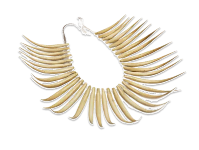 Circular necklace made from numerous curved ivory-coloured tusk-shaped elements radiating around a central opening.