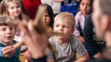 Children learn about a sea star in the Ocean Wonders presentation..