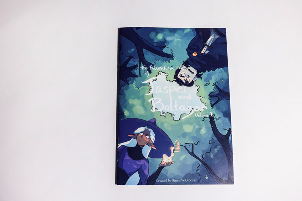 Book cover showing a pair of animated human characters, viewed from below, with tree branches above them, in blue and green tones.