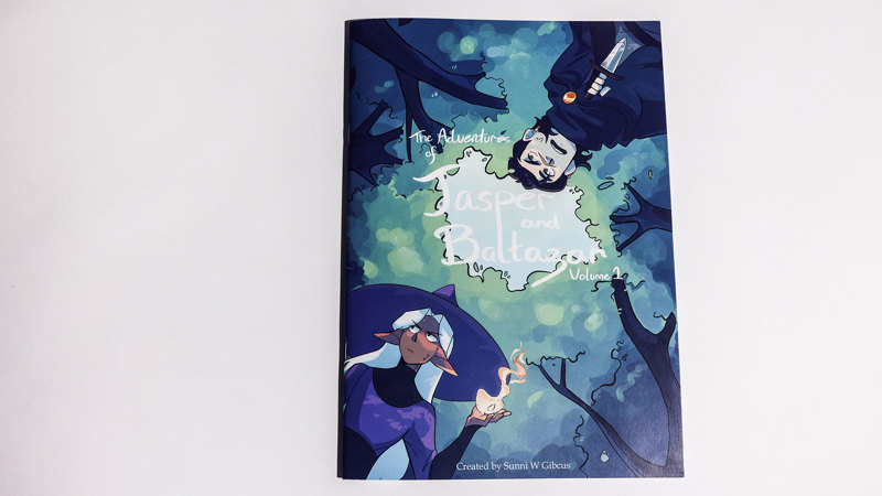 Book cover showing a pair of animated human characters, viewed from below, with tree branches above them, in blue and green tones.