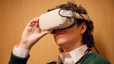 A student in the Road to Zero Learning Studio wearing a virtual reality headset 